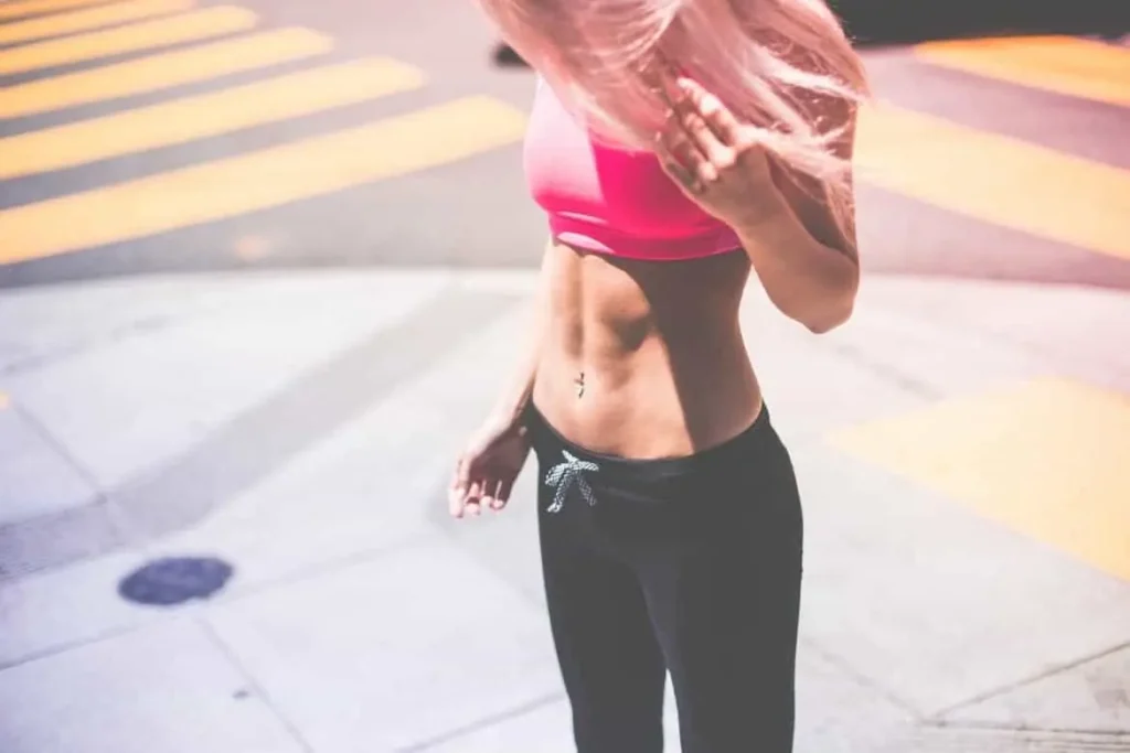 Woman with toned stomach after LA-EMS Body Sculpting Treatment Rayleigh